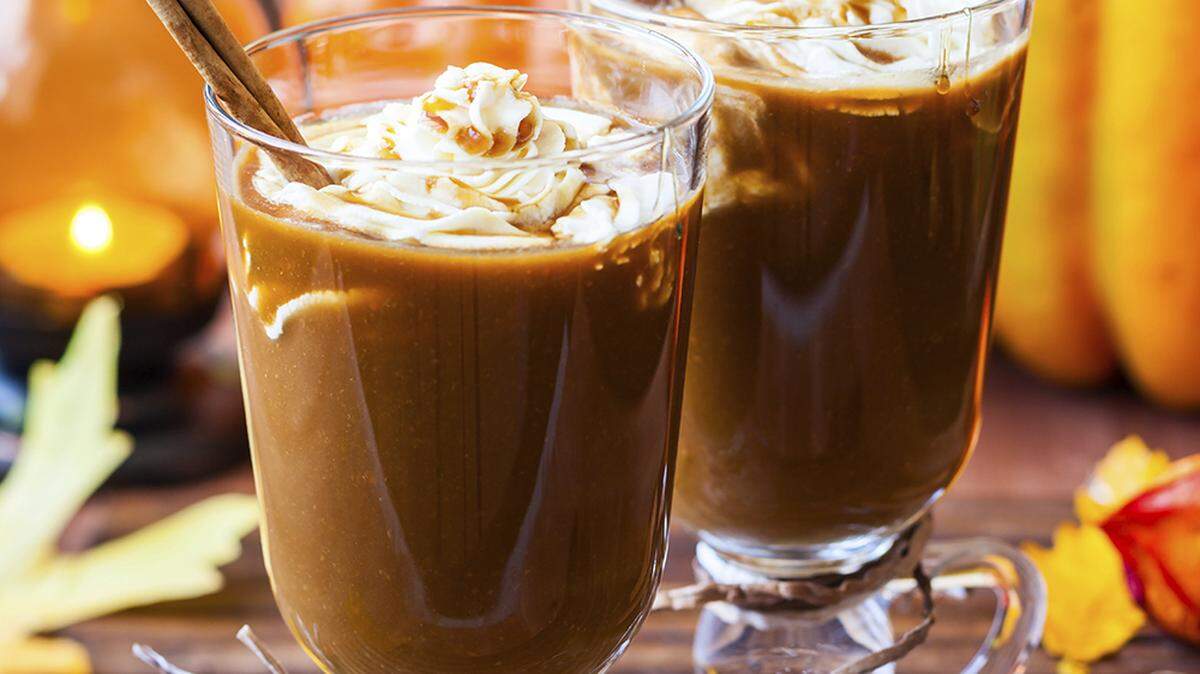 Pumpkin spice coffee with whipped cream and caramel