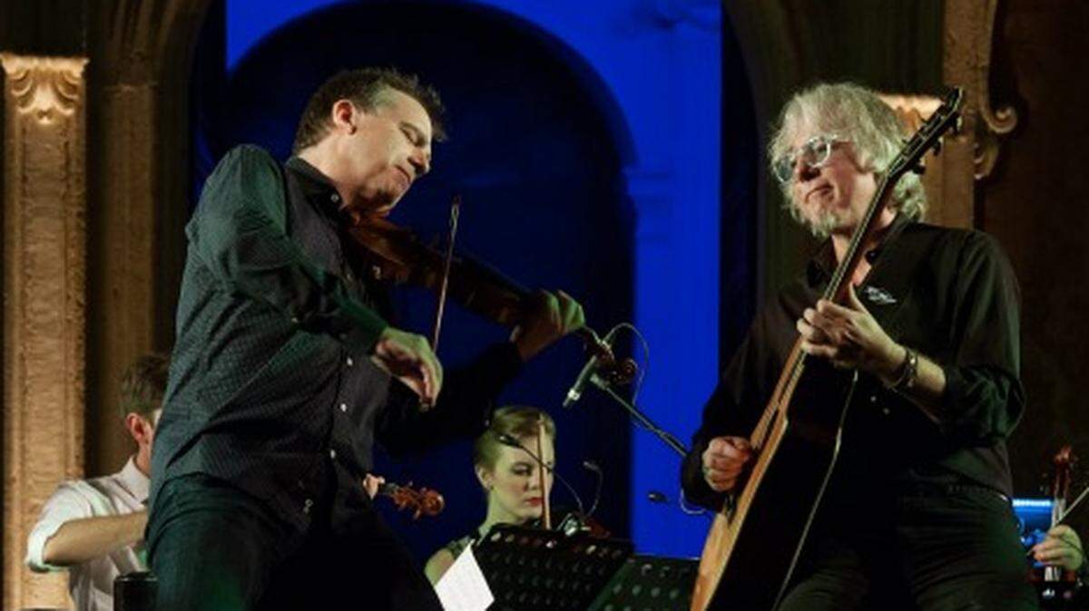 Violinist Robert McDuffie and former R.E.M. bassist Mike Mills perform 'Concerto for Violin, Rock Band and String Orchestra.'