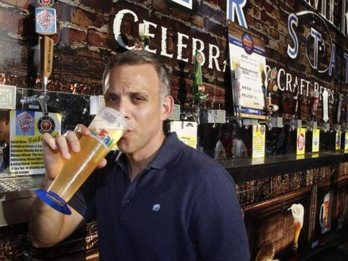 Miami Herald Food Editor, Carlos Frias, has a beer at Beer Haven's Cotton Candy Beer priced at $8 or $10 in souvenir cup 16 oz., one of the weirdest foods at the Miami-Dade Youth Fair this year, March 31, 2016.