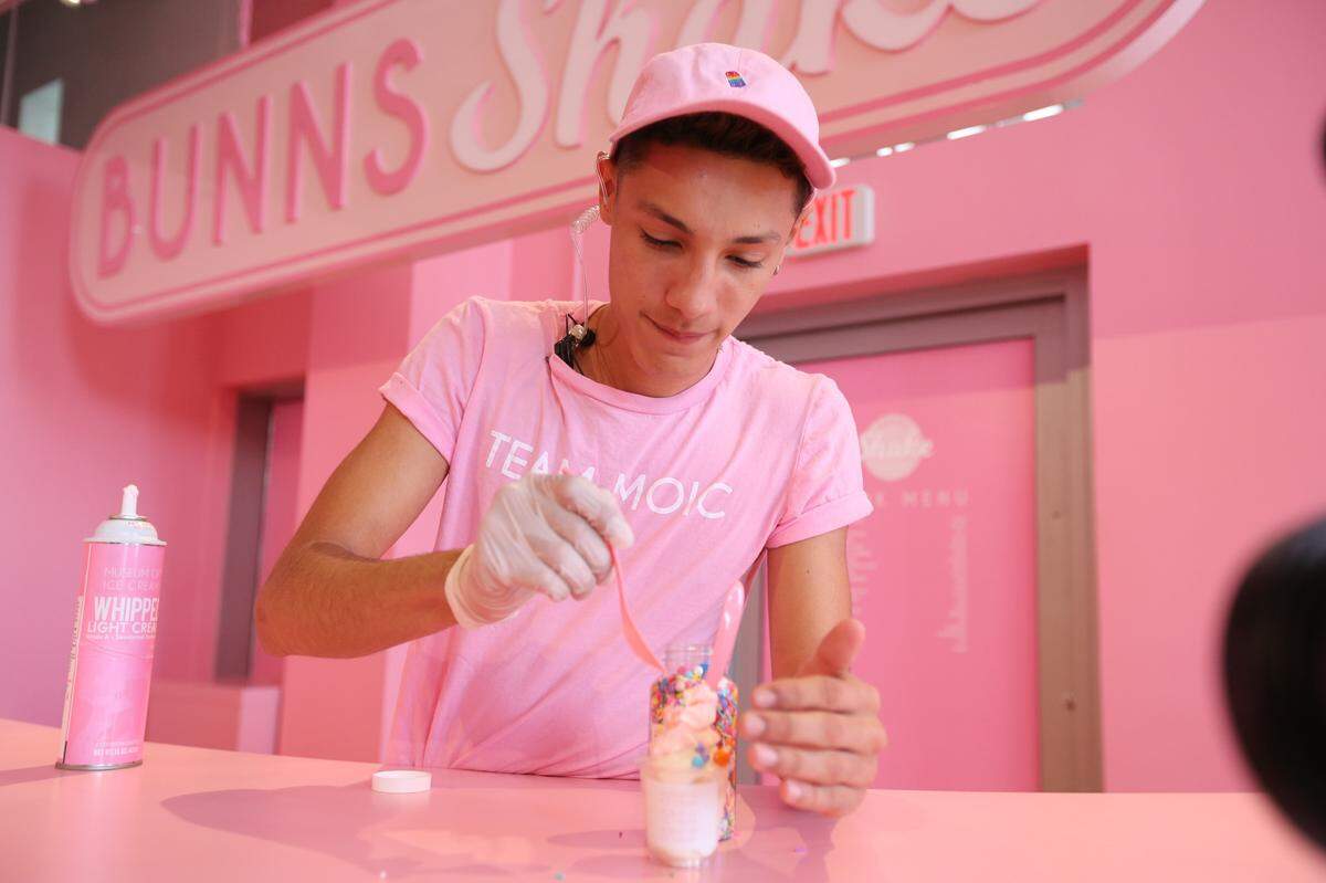 Enmanuel Muller, A.K.A. Mango Manny, adds sprinkles to the ice cream treat given to guests entering the 'Bunns Shake' room at The Museum of Ice Cream on Thursday, Dec. 7, 2017. The museum has opened its fourth U.S. location, this time on Collins Ave. in Miami Beach. The museum offers guests the chance to taste, smell, swing and even swim in all things ice cream. (Emily Michot/Miami Herald)