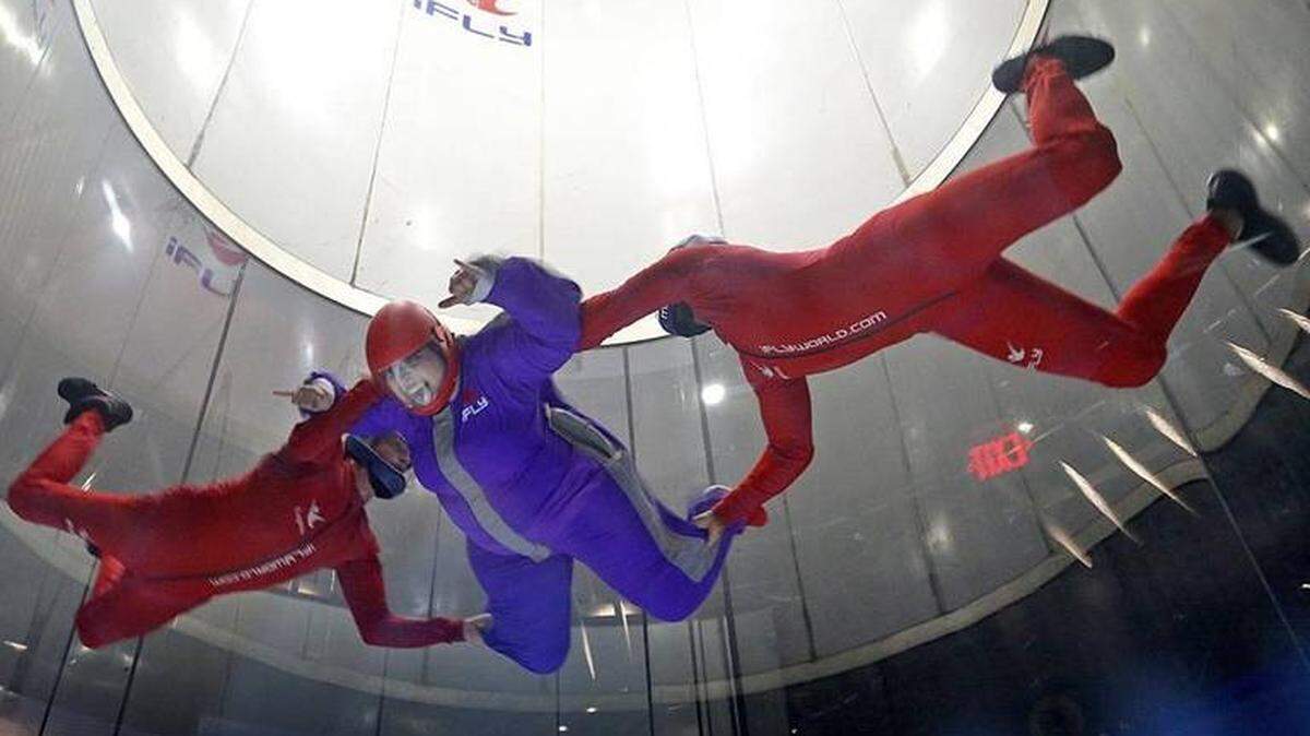 Jessika Kattah, who is a paraplegic, soars with a little help from the instructors at iFly.