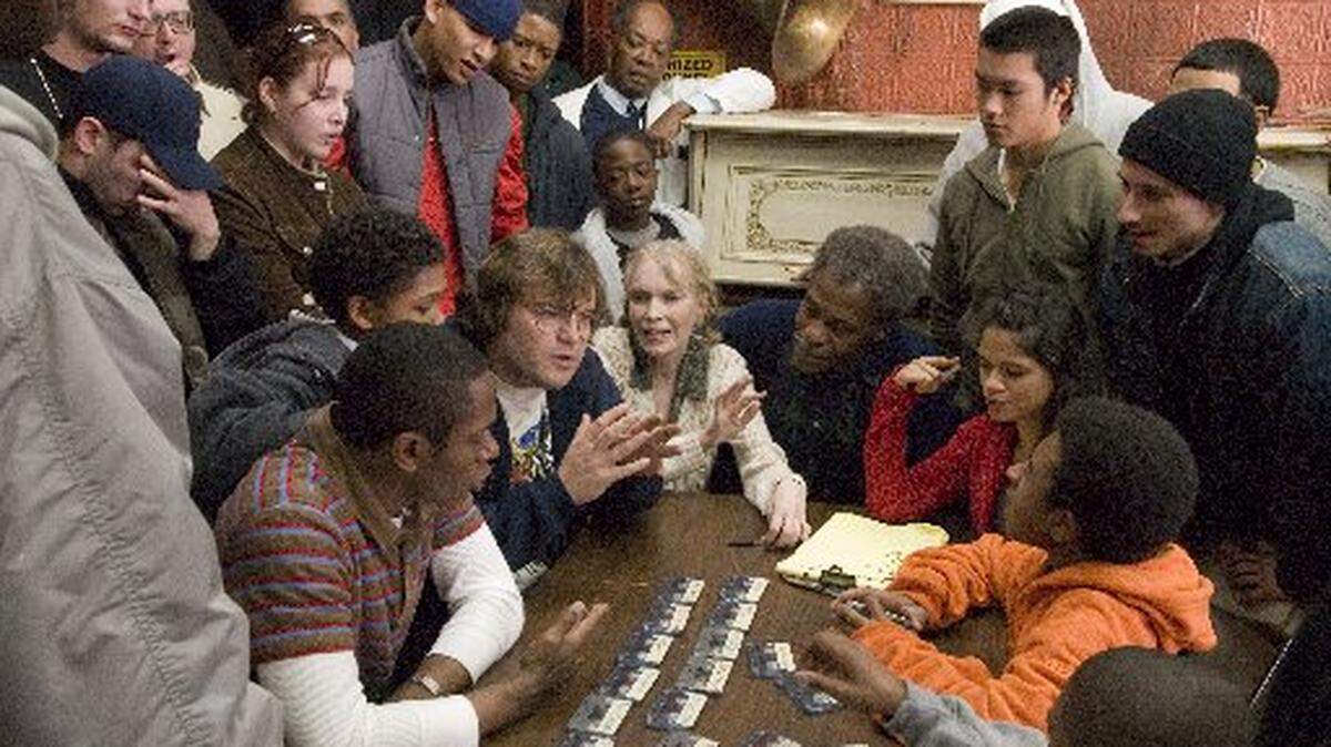 The cast of Be Kind Rewind includes, seated from left, Mos Def, Jack Black, Mia Farrow, Danny Glover and Melonie Diaz.