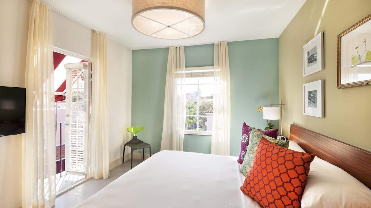 Inside a sun-filled junior suite at El Paseo, a Miami Beach hotel that is offering a discounted rate for locals who have been left without power.