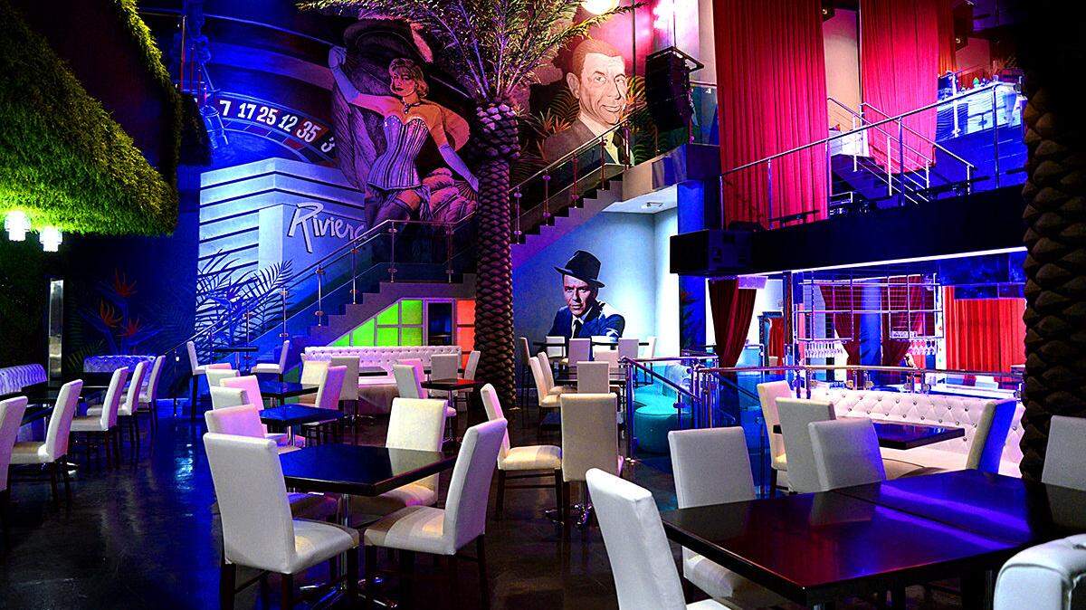 A mural of American mobster and Hotel Habana Riviera owner Meyer Lansky overlooks the dining area of the new Riviera Live in Coral Gables.