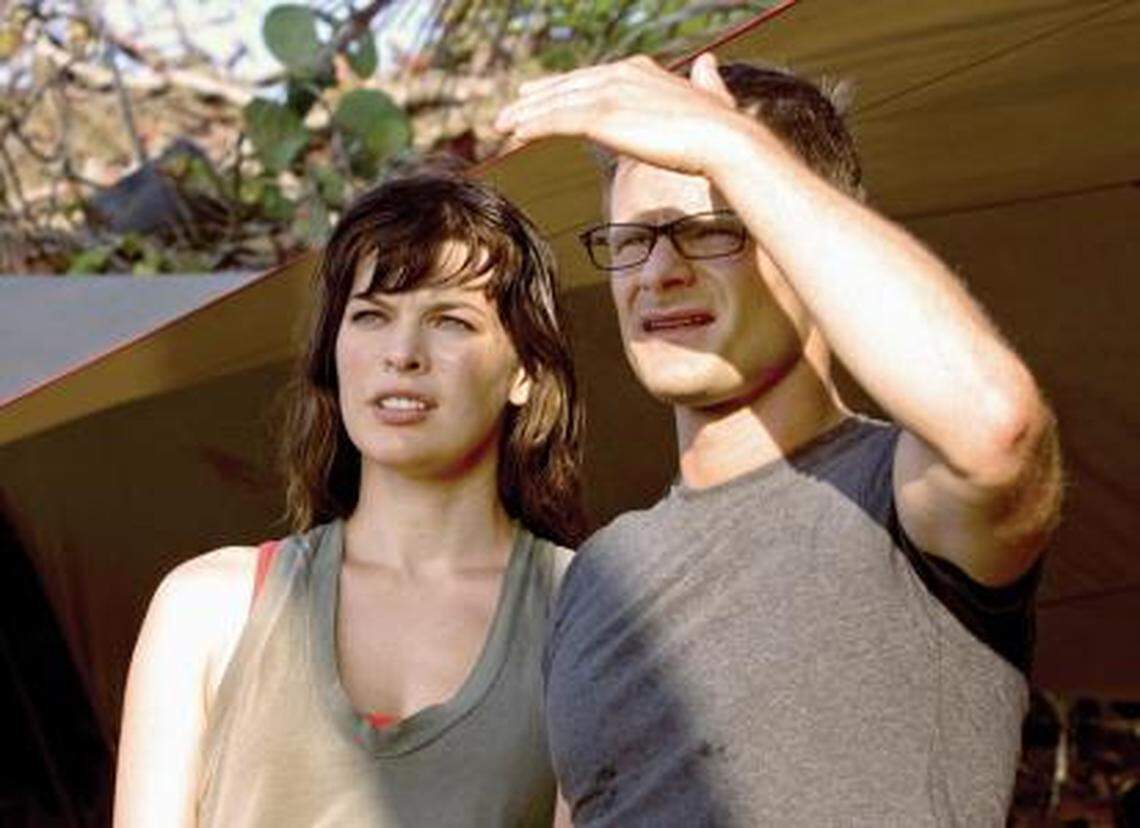 Milla Jovovich, left, as Cydney and Steve Zahn as Cliff, an adventurous young couple celebrating their honeymoon in a paradise t