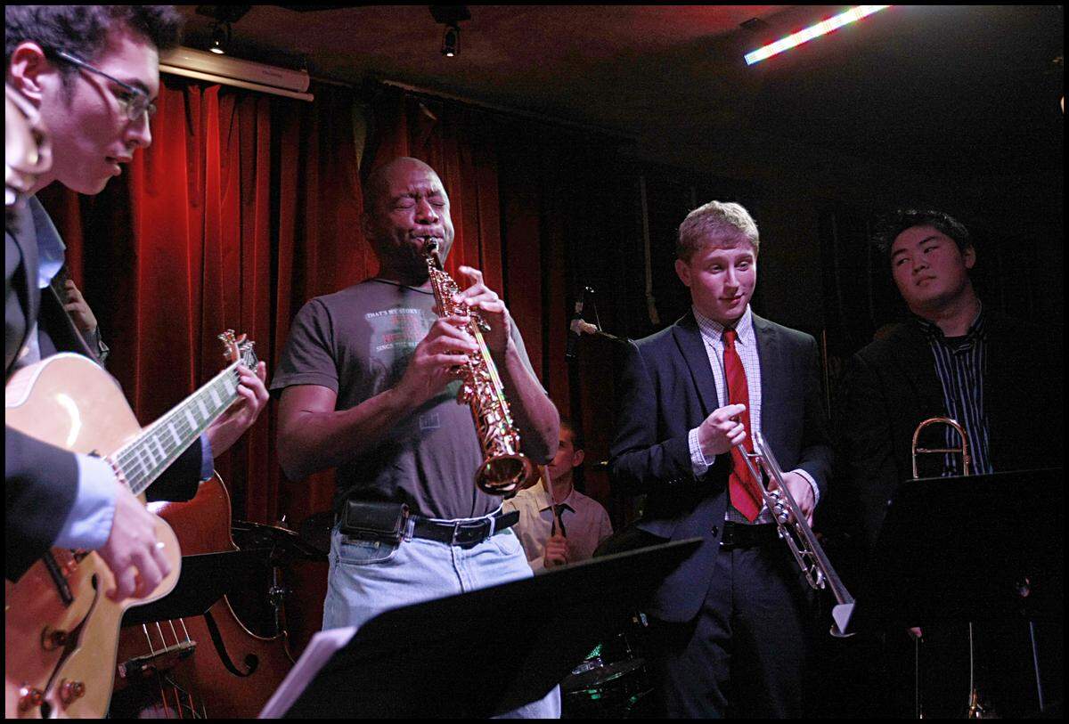1/ 14 / 2011.  Jazz music icon Branford Marsalis, performed with a band of students ( from left- Gabriel Schnider ( NY), guitar,  Nick Singer (NY), trumpet ) and Jon Hatamiya ( CA), trombone ) at Van Dyke Cafe in Miami Beach. The students are in Miami as part of the YoungArts Week 2011 celebrated every year, when up to 150 of the nation's most talented 17-18 year old artists, spanning nine disciplines converge in the city.  YoungArts  was founded in 1981 by the late Ted Arison, founder of Carnival Cruises Lines. This year is celebrating its 30th anniversary.  Thursday, January 13, 2011.