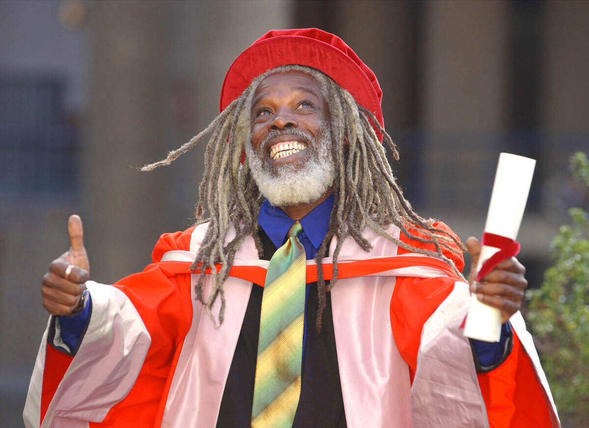 Singer Billy Ocean is all smiles after receiving an honorary Doctor of Music degree in recognition of his services to the music industry from the  University of Westminster at the Barbican Centre in London Monday Nov. 11, 2002. (AP Photo/PA, Andy Butterton) ** UNITED KINGDOM OUT - MAGAZINES OUT - NO SALES **