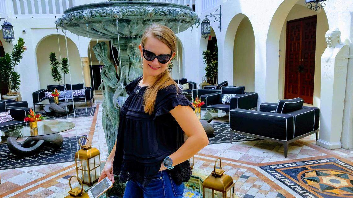 On most days, she eats at Chicken Kitchen in Kendall. Today, however, she’s posing for the paparazzi at the former Versace mansion.