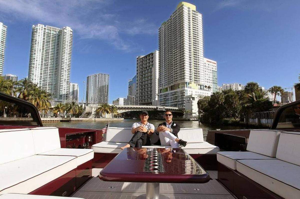 From left to right, YachtLife cofounders Patrick Curley and Nick Cardoza pose for the picture at River Yacht Club in Miami.