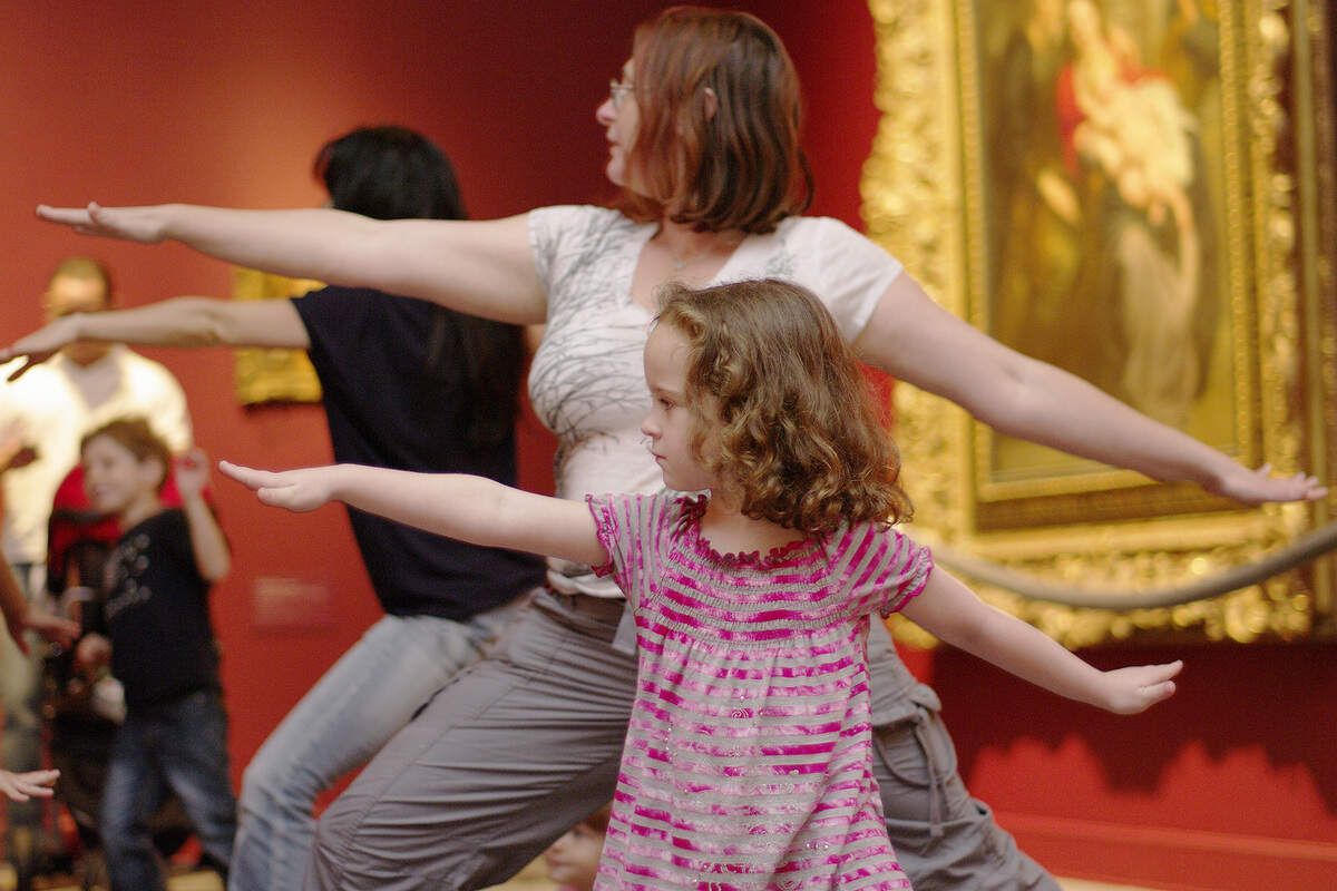 7/31/11--Isabella Klopukh, 5, and her mom Marina Kievsky practice the warrior pose during the first family yoga session during IDEA@thebass day at the Bass Museum of Art in Miami Beach.  The family yoga is part of its monthly IDEA@thebass program that runs every last Sunday of the month. In support of First Lady Michelle Obama's "Let's Move" initiative, which focuses on fighting childhood obesity and putting children on the path to a healthy future, for more information contact the Bass Museum of Art at 2100 Collins Ave. Miami Beach, FL 33139