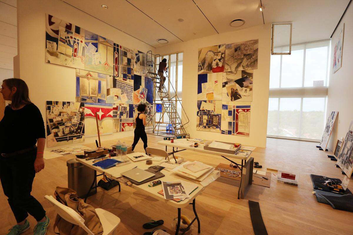 Installers work at a quick pace to hang a complex piece of art by artist, Anna Oppermann entitled, "Paradoxical Intentions (To Lie the Blue Down from the Sky)", 1988-1992, Wednesday, Nov. 15, 2017 at the Institute for Contemporary Art. (Emily Michot/Miami Herald)