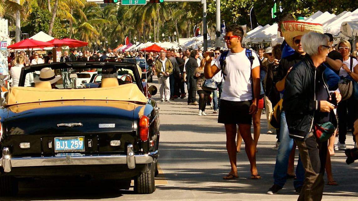 Checking out the classic cars on Deco Drive during Art Deco Weekend.