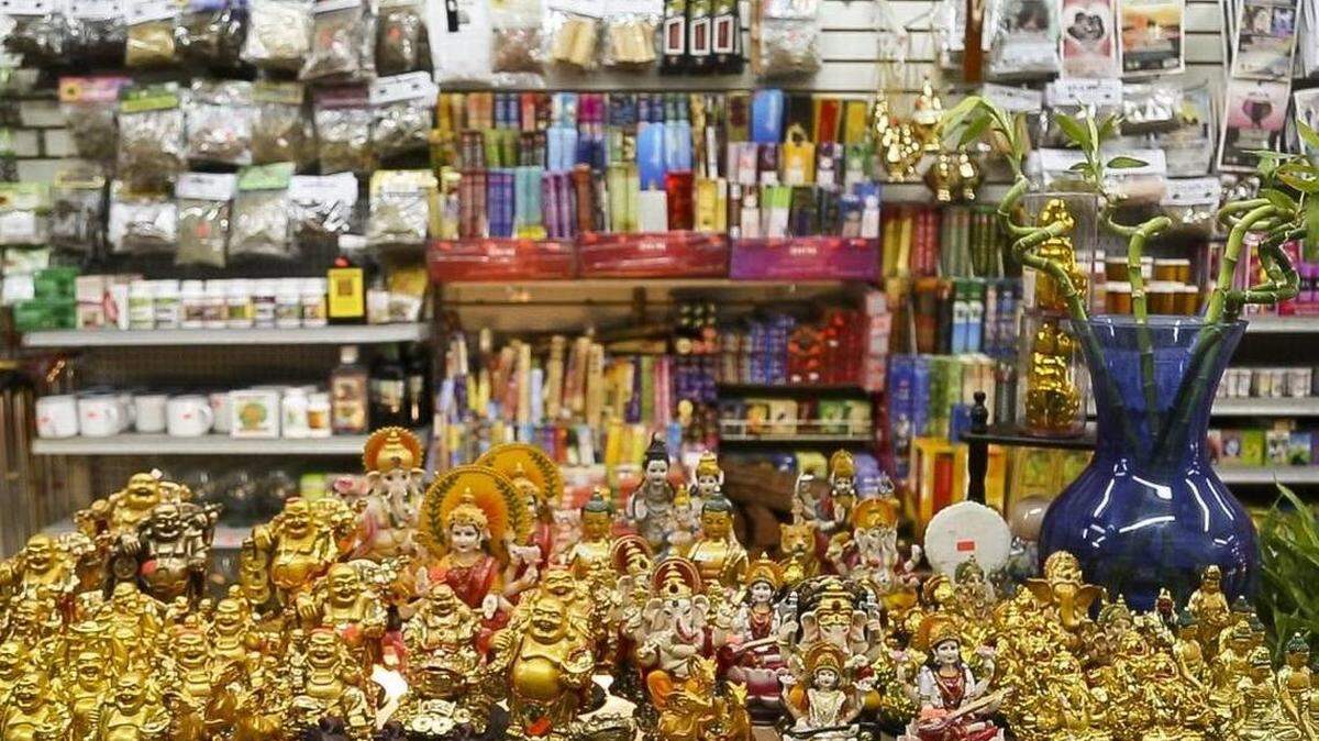 Buddha statues sit on a shelf at the Botanica M&N Variedades in Little Havana.