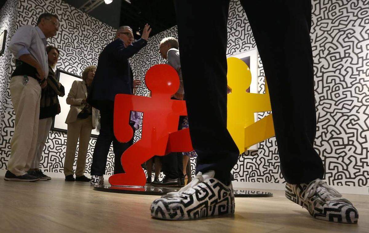 Emilio Steinberger’s shoes match the Keith Haring work at the Levy Gorvy space during Day 1 of the annual Art Basel Fair at the Miami Beach Convention Center on Wednesday December 5, 2018.