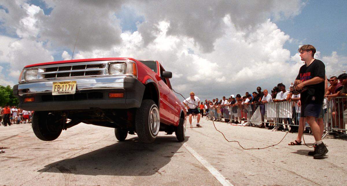 7-09-95/Robert Browman/For the Herald--Pat Burke, from Lakewood, N.J., bounces his truck on it's hydraulic shocks during the car dance competition at the low rider convention at the Youth Fair and Expo Center Sunday.