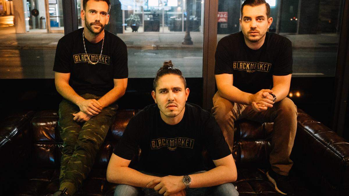 Miami natives Shane Vernon, Erick Passo, and Michael Mora opened Black Market, a sports bar in downtown Miami.
