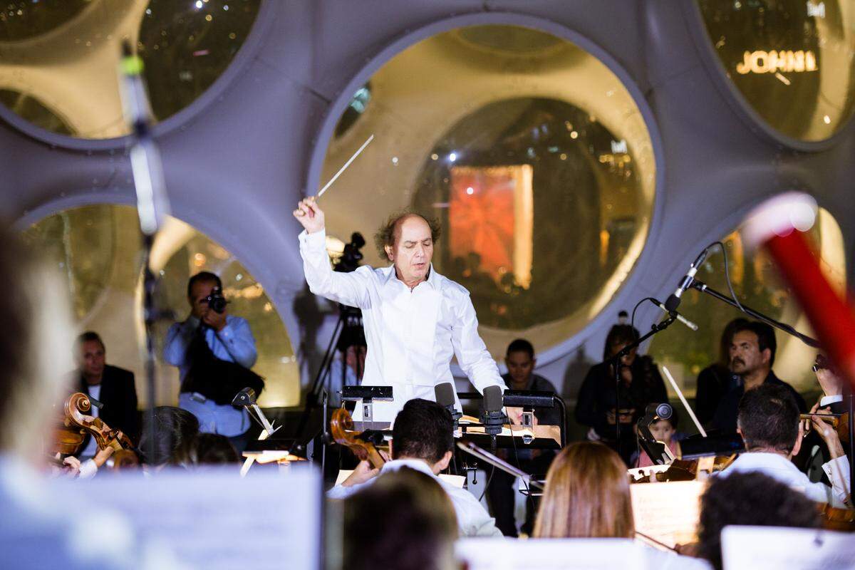 Maestro Eduardo Marturet conducts Orchestra Miami in a free concert in the Palm Court.