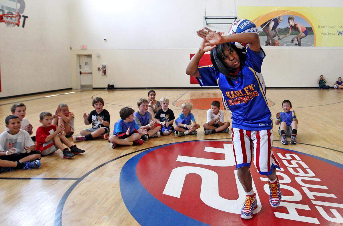 TNT Maddox – one of the team’s female stars demonstrates a few tricks of the trade as the world famous Harlem Globetrotters team up with 24 Hour Fitness to host a total of 18 Summer Skills Clinics in the Miami area. Clinics run from June 17-22 for boys and girls ages 6-12 in the South Florida Area..
