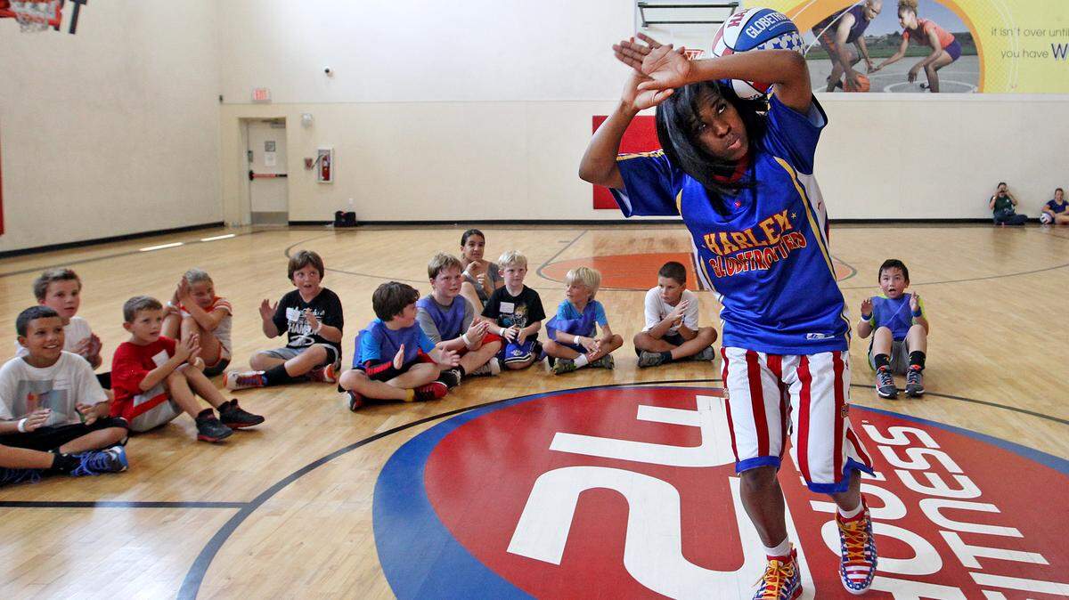 TNT Maddox – one of the team’s female stars demonstrates a few tricks of the trade as the world famous Harlem Globetrotters team up with 24 Hour Fitness to host a total of 18 Summer Skills Clinics in the Miami area. Clinics run from June 17-22 for boys and girls ages 6-12 in the South Florida Area..