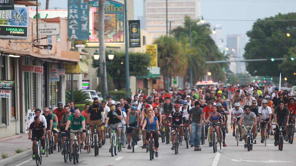 Bicyclists take to the streets for Miami Critical Mass, a monthly bike ride through the streets of Miami.