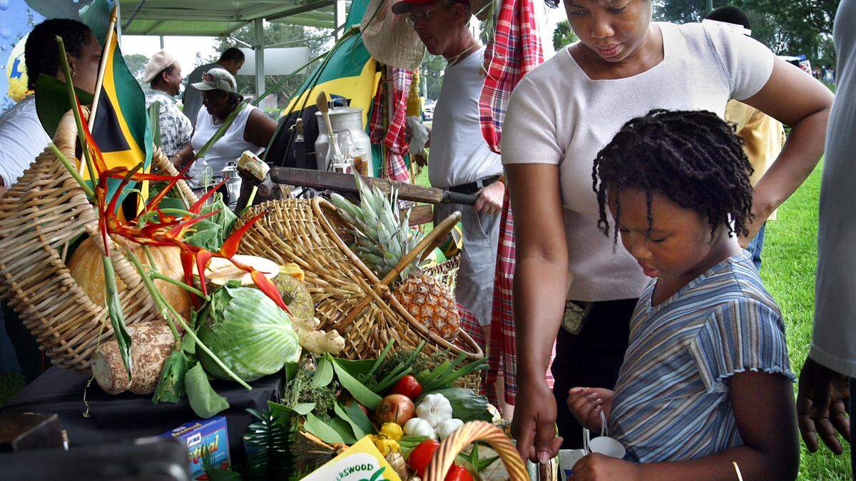 Jamaican Jerk Festival lured thousands Sunday to C. B. Smith Park in Pembroke Pines for hours of feasting on hot and spicey island pork, chicken, fish, and  vegetables accompanied by Carribean island drinks including plenty of Red Stripe beer.