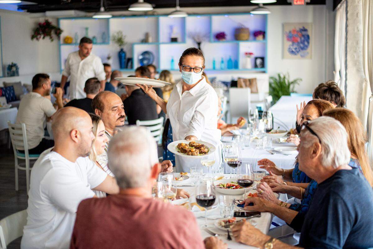 Diners being served at Alexander Greek Taverna.