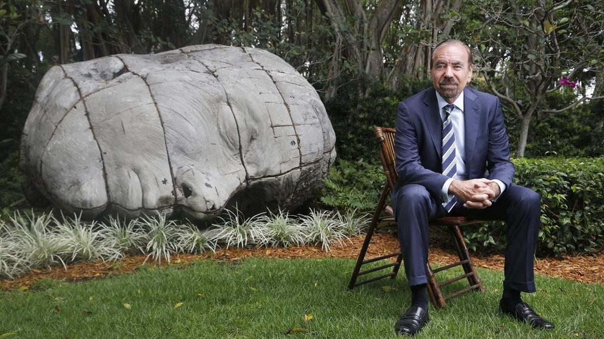 Developer and art collector Jorge Pérez in the garden at his Coconut Grove home, with South African artist Ledelle Moe’s piece “Memorial Collapse V.” Photographed on Monday, April 4, 2016