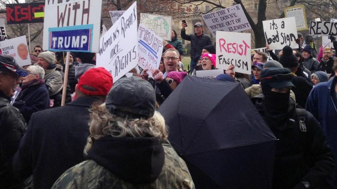Supporters and opponents of president Donald Trump face off in front of the Ohio state house in this 2017 file photo.
