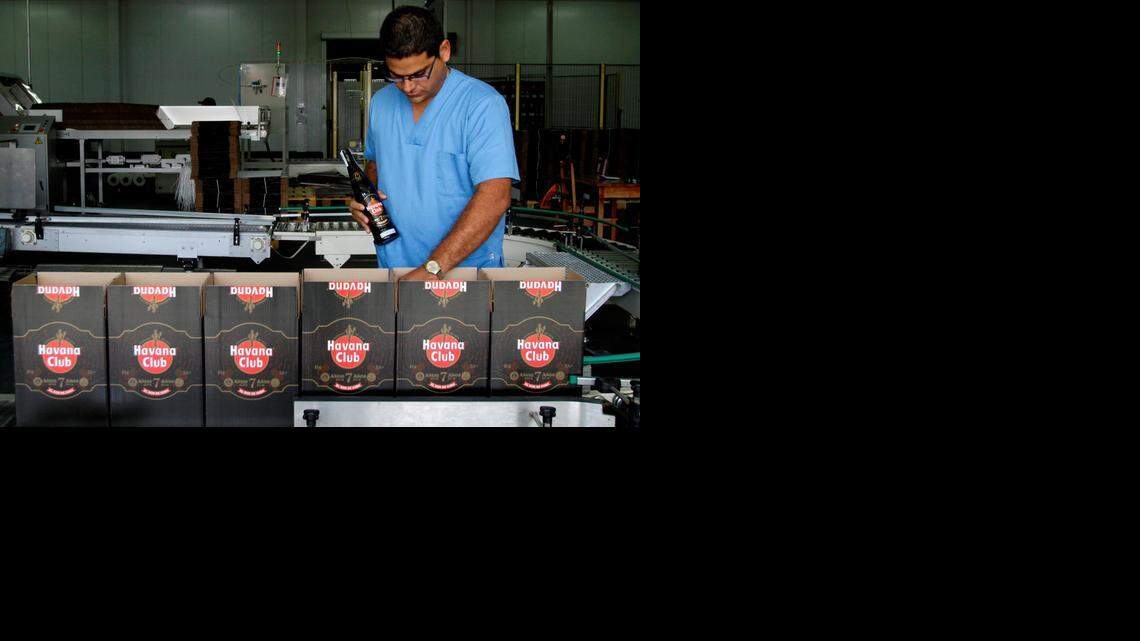 
In this Oct. 22, 2010, file photo, a worker checks the production of Havana Club rum at the company's factory in Havana, Cuba. U.S. rum aficionados are abuzz over the potential for making Cuba Libres with Cuban rum, now that Americans visiting the Caribbean island will be allowed to bring home rum distilled there for the first time since the embargo took effect 55 years ago. 
