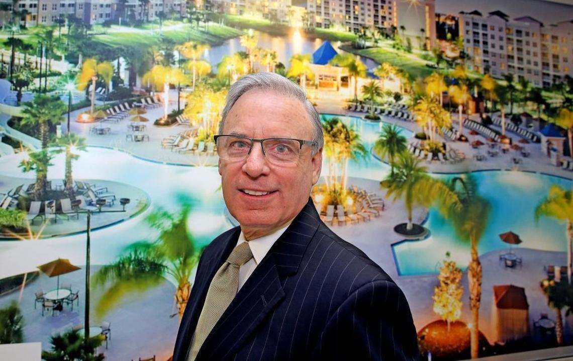 Alan Levan stands in his Fort Lauderdale office, in front of a mural of a Bluegreen Corp. resort that’s in Orlando. BBX owns Bluegreen, a vacation timeshare company that owns and manages resorts in vacation destinations worldwide — including The Fountains in Orlando, depicted here.