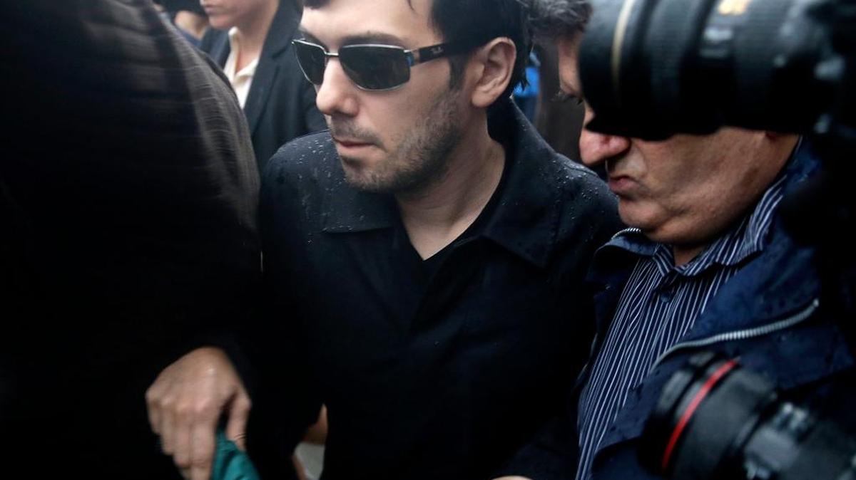 Martin Shkreli leaves courthouse after his arraignment in New York, Thursday, Dec. 17, 2015.