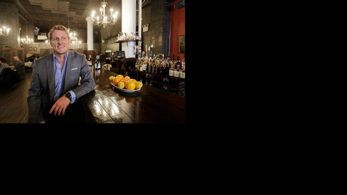 
Jayson Seaver poses on Dec. 16 for a photo in New York’s Harding’s restaurant, of which he is a part owner. Seaver feels the wealth gap has affected his relationship with his sister.
