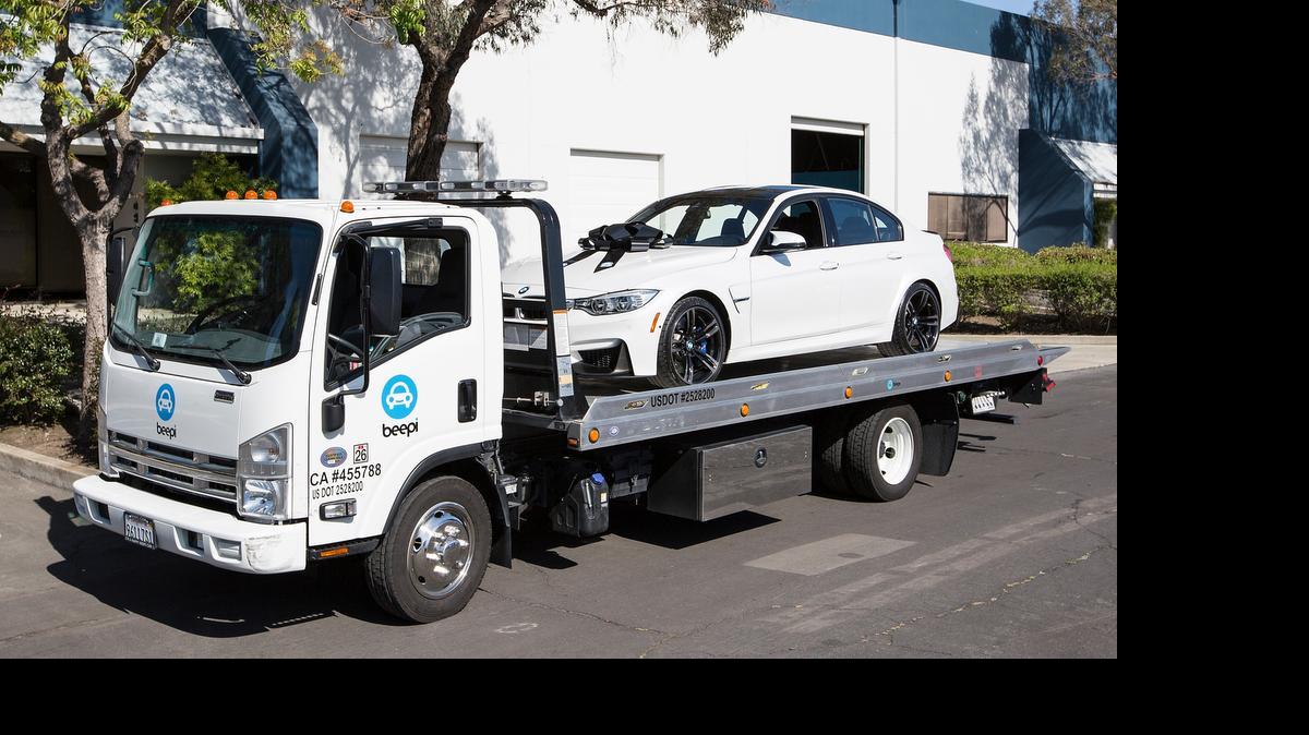 
Beepi delivers cars in shrink wrap and adorned with a bow.
