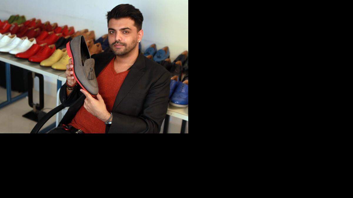 
Kabeer Arora is the designer and owner of Kabaccha Shoes in Miami. He holds an Italian-made grey and red loafer, one of the styles currently offered on his highly successful Kickstarter campaign.


