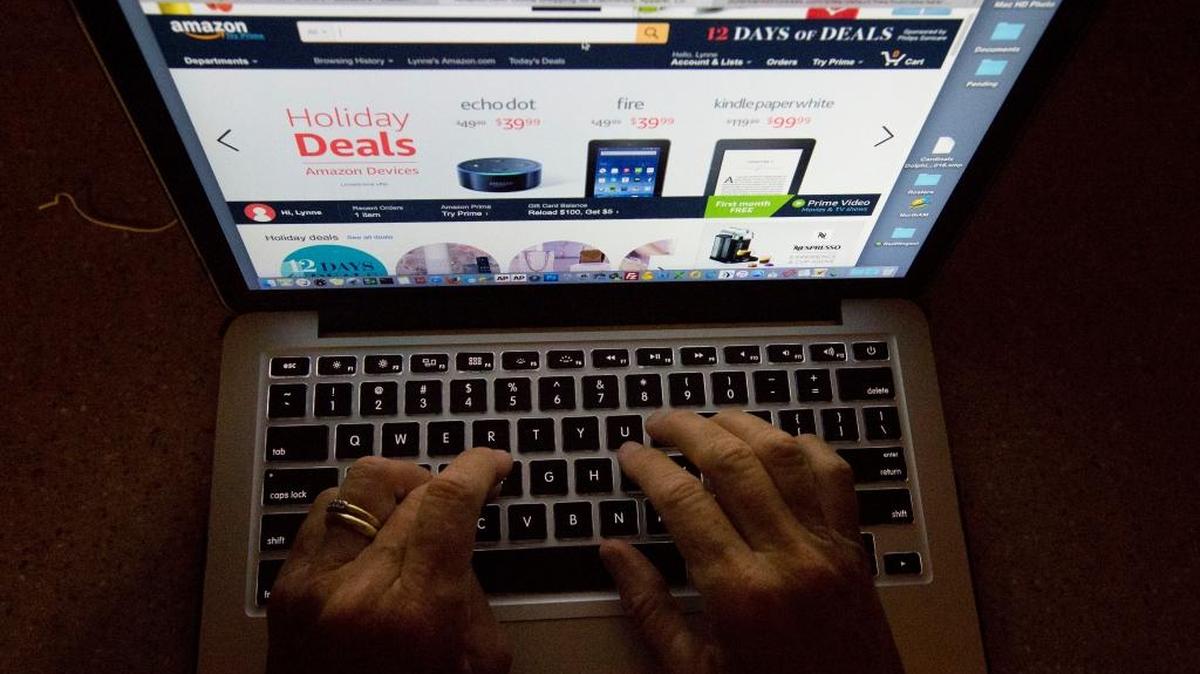 In this 2016 file photo, an online shopper searches a site, while logged in from Miami. Procrastinating holiday shoppers are finding a haven online with expedited shipping and same-day delivery services.