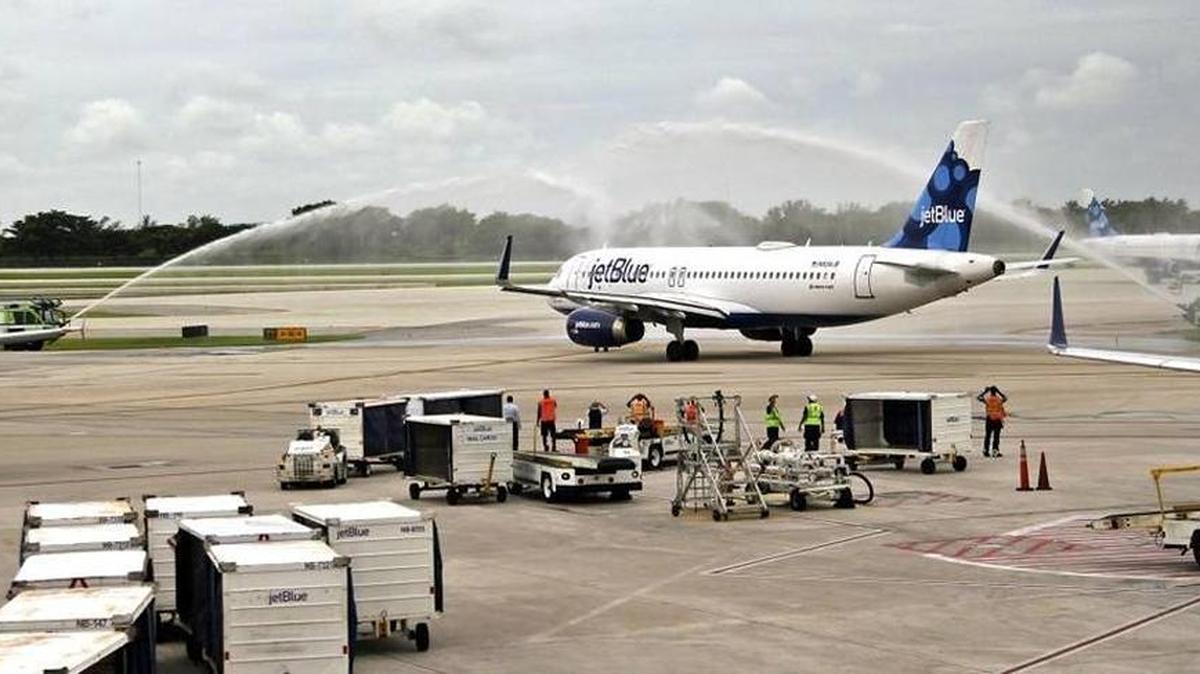 JetBlue Flight 387 taxis on to the runway under a water canon salute as it departs for Cuba. On Wednesday, August 31, 2016, JetBlue became the first U.S. airline to initiate commercial flights with Cuba in more than 50 years, kicking off with a flight from Fort Lauderdale-Hollywood International Airport to Santa Clara.
