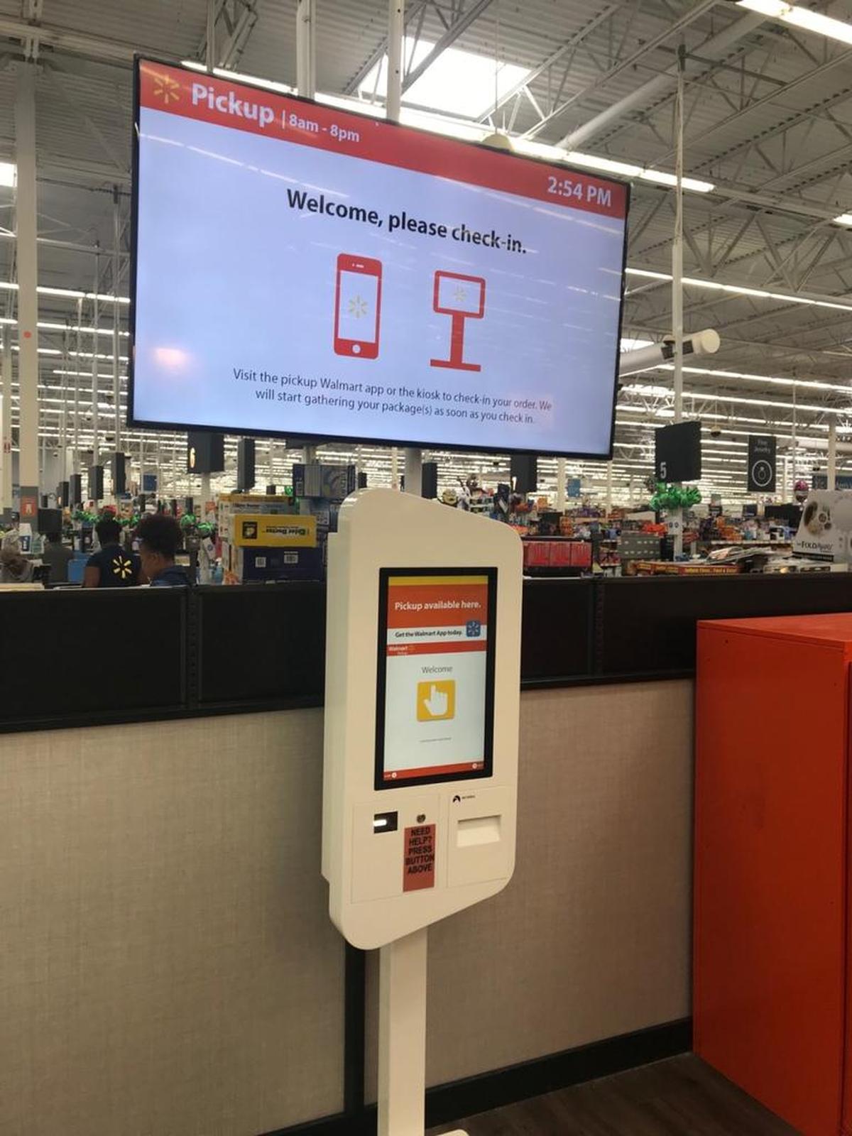 The check-in screen for Walmart’s new pickup towers. Customers scan a barcode of their purchase receipt and the machine releases the item.