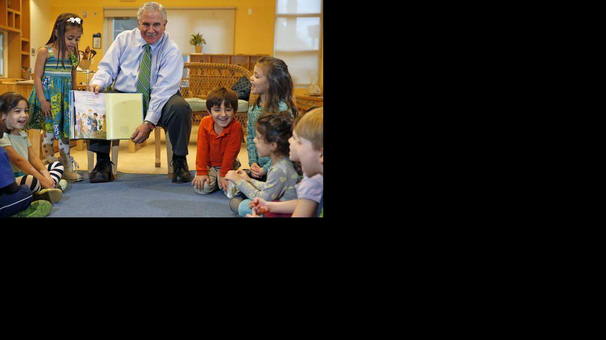 
Harve A. Mogul, President and CEO of United Way of Miami-Dade, reads to students at the United Way Center for Excellence in Early Education Center on Tuesday, February 3, 2015. At left is Jazmin, 4. 
