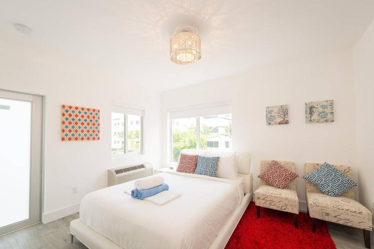 A bedroom in a Boutique 18 unit that is advertised on Airbnb. All units are apartment-style with kitchens.