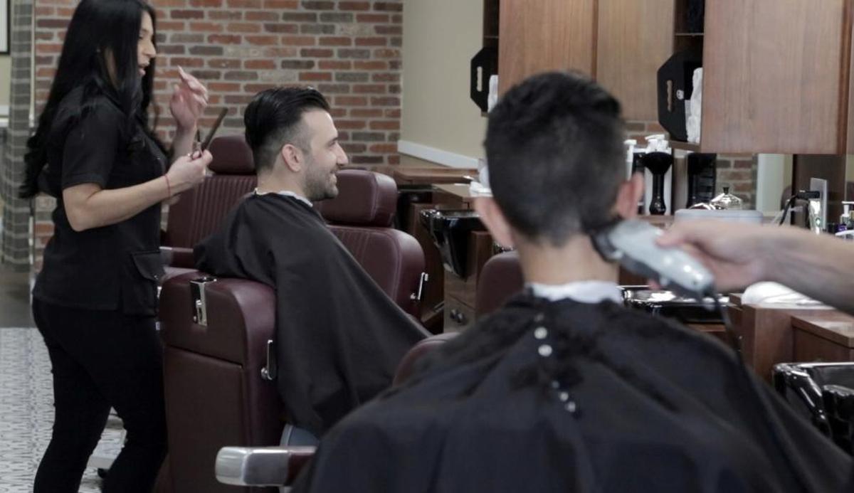 Clients getting their hair cut at Primos Barber Shop in Kendall in 2017.