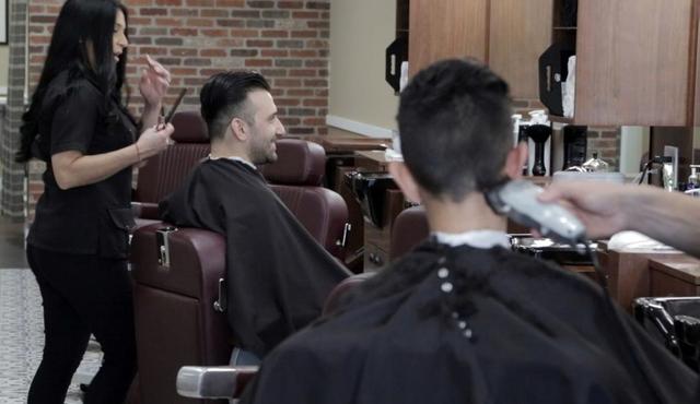 Clients getting their hair cut at Primos Barber Shop in Kendall in 2017.