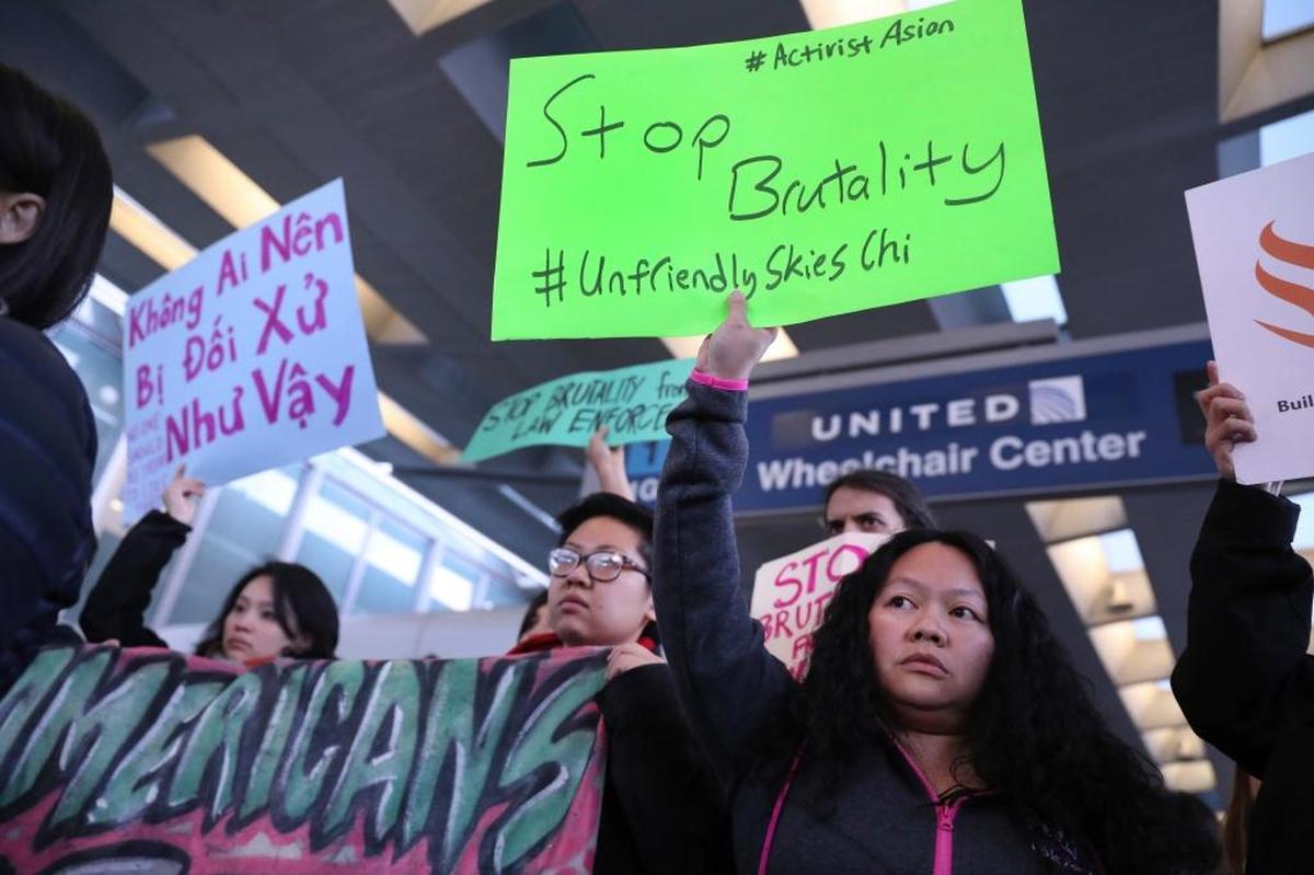 People with Asian community organizations from Chicago protest on Tuesday, April 11, 2017, after David Dao, 69, of Elizabethtown, Ky., was removed from a United Airlines airplane by Chicago airport police at O’Hare International Airport.