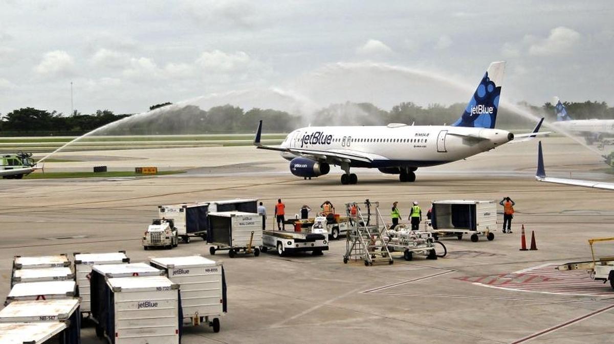 JetBlue Flight 387 taxis onto the runway under a water canon salute as it departs for Cuba. On August 31, 2016. JetBlue became the first U.S. airline in more than 50 years to initiate commercial flights with Cuba, kicking off with a flight from Fort Lauderdale-Hollywood International Airport to Santa Clara, Cuba.