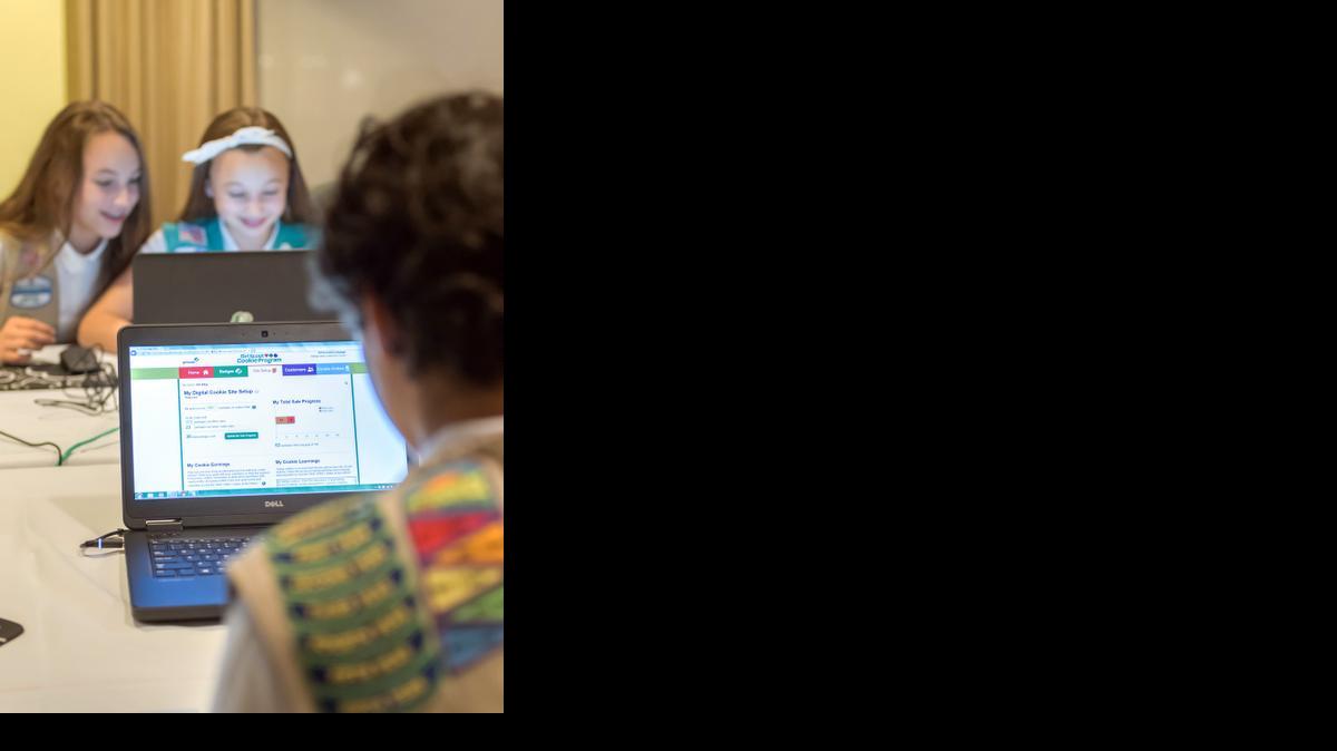 
In this undated photo released from Girl Scouts of the USA, Olivia and Isabella practice selling cookies on one of two new digital platforms. 
