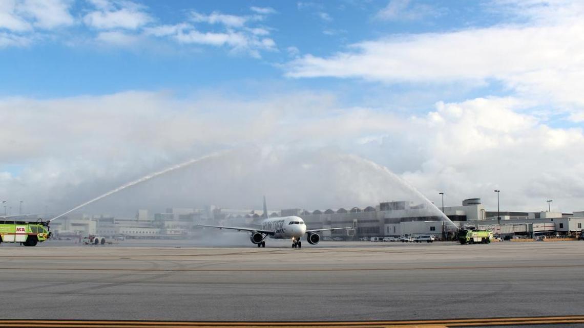 Water cannons salute a Frontier plane as it takes off from Miami International Airport on its inaugural flight to Havana on Dec. 1, 2016. The airline is canceling the route in June.