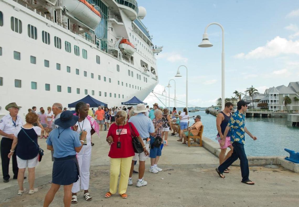 Passengers from the Empress of the Seas walk on the Pier B cruise ship dock after the ship arrived in Key West, Fla., Sunday, Sept. 24, 2017.