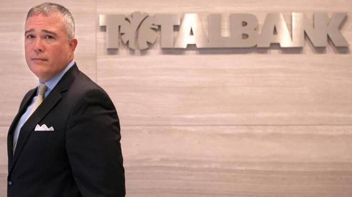 TotalBank lays off as many as 100