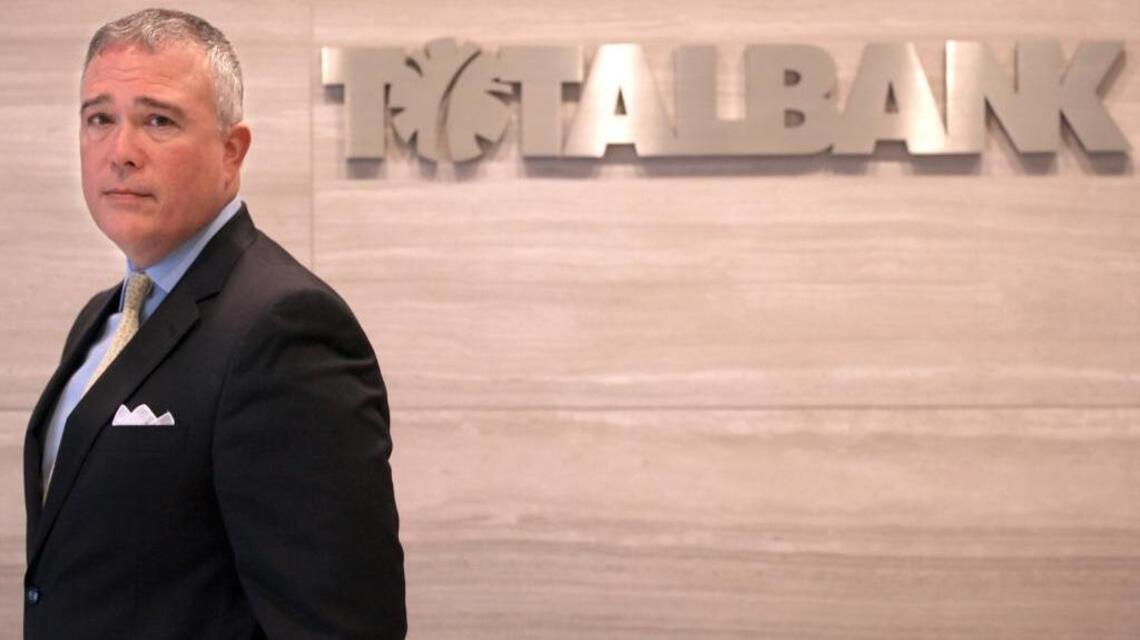 After big layoffs, TotalBank CEO resigns
