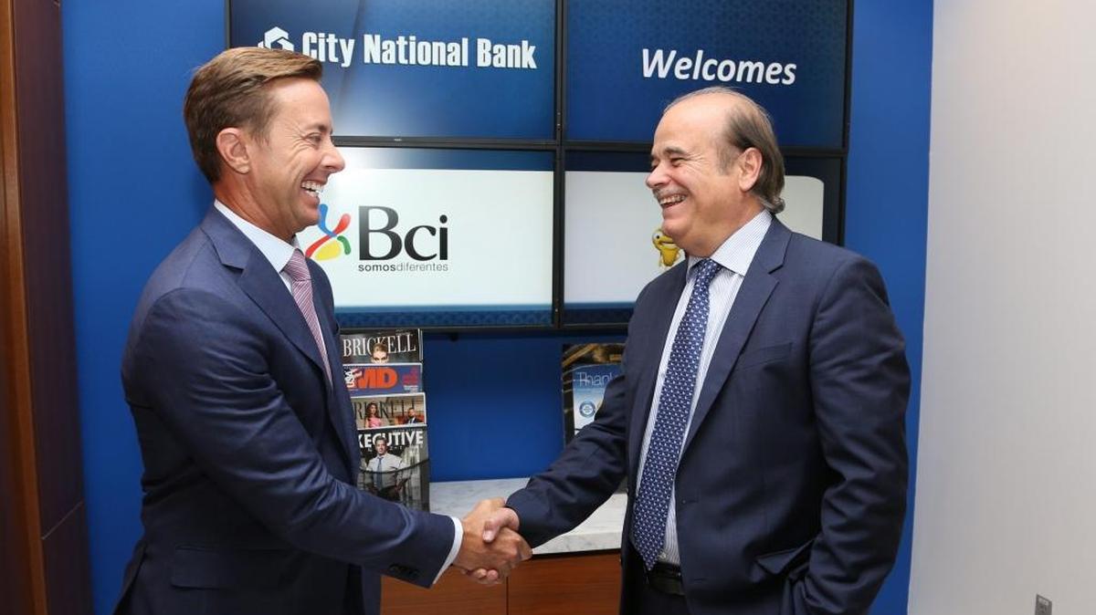 
CEO of City National Bank Jorge J. Gonzalez (left) meets with Eugenio von Chrismar Carvajal (left), the CEO of Banco de Crédito e Inversiones, at the City National Bank offices in Brickell. Chilean BCI is buying City National Bank in a deal expected to close Friday morning.
