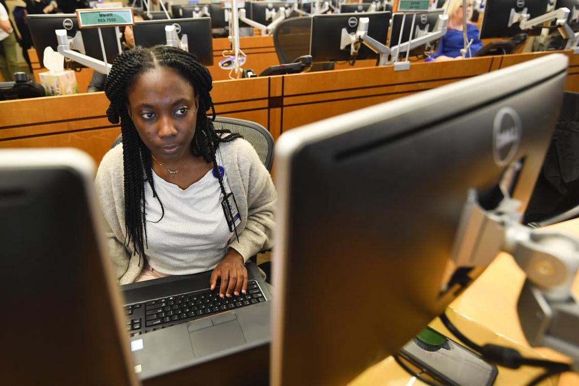 Personnel at the The Centers for Disease Control and Prevention (CDC) work the Emergency Operations Center in response to the 2019 Novel Coronavirus, among other things, Thursday, Feb. 13, 2020, in Atlanta.